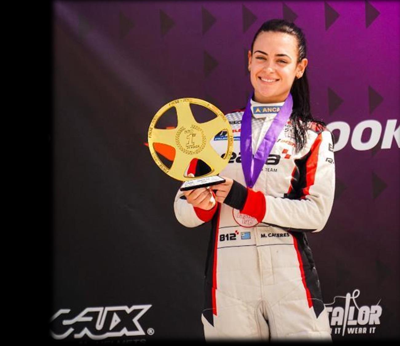 Maite Cáceres holding her winner's trophy, F4 FARA 2026